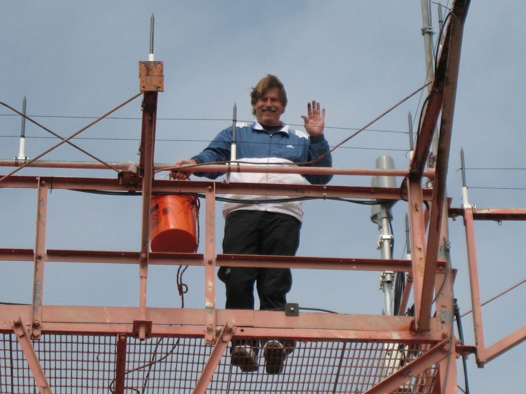 worker installing bird control product